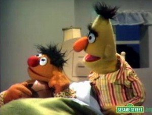 Ernie goes to bed with a basketball.