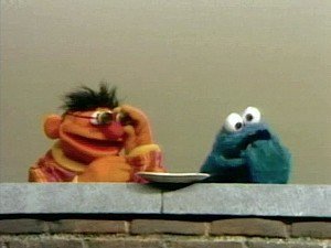Ernie, his magic glasses, and Cookie Monster