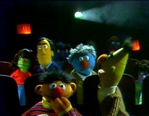 Bert defends Ernie at the movies. 