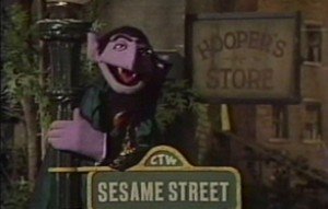 The Count hangs out on Sesame Street.