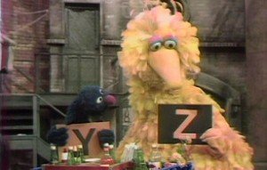 Grover and Big Bird demonstrate the end of the alphabet.
